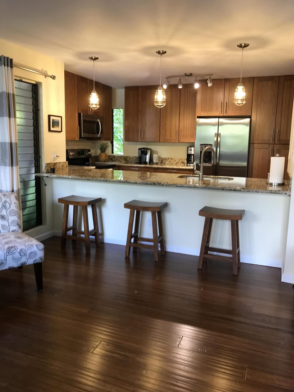 Living space has LED dimmer lighting in kitchen