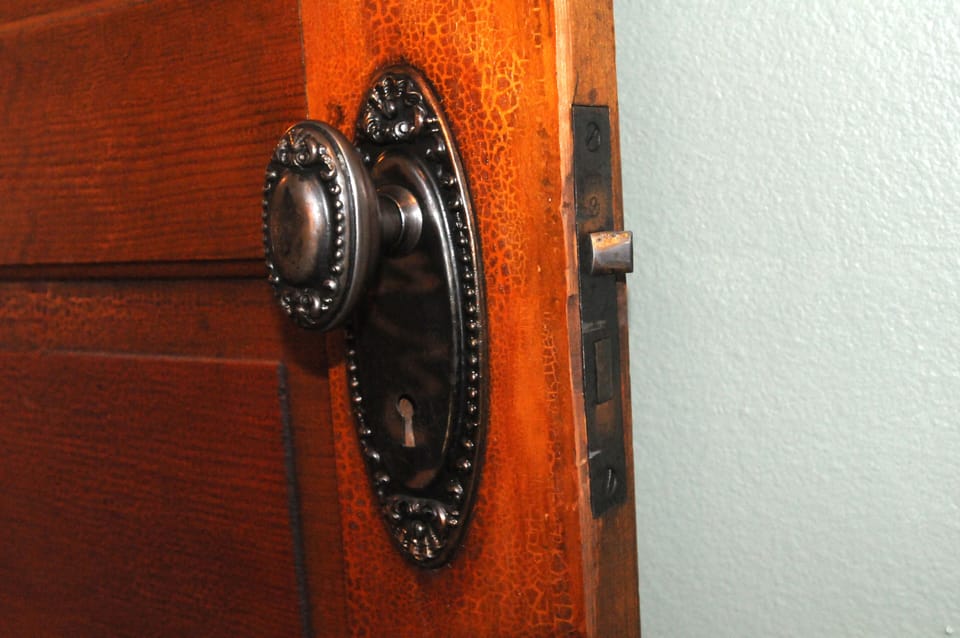 Original hardware, floors add to the charm.