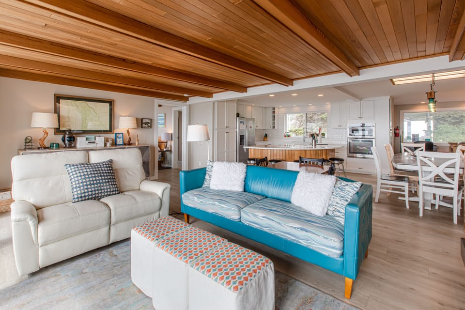 Living area is open to kitchen and dining.