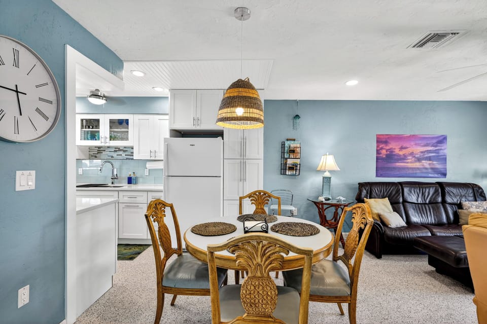 The dining area is adjacent to the kitchen area.   