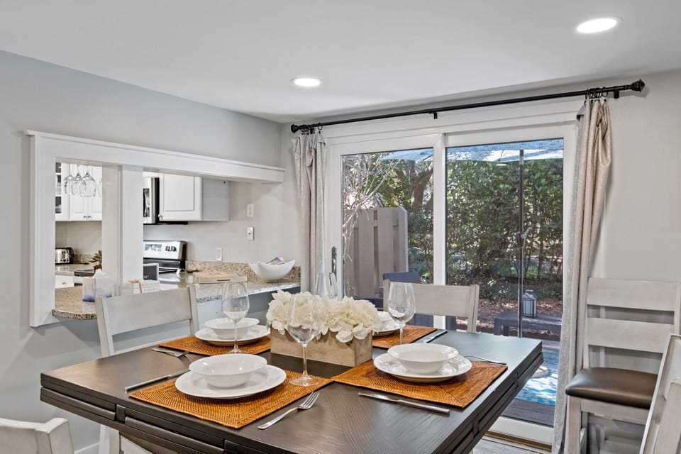 Dining space has dimable lighting and enjoys a view to the side and back patios