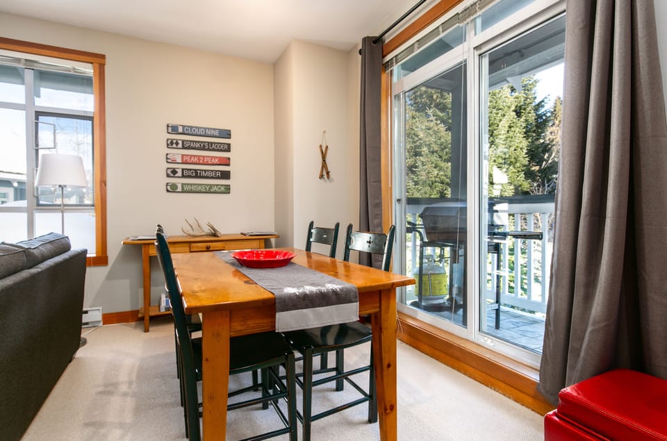 Dining area next to walk out patio/BBQ and well appointed kitchen