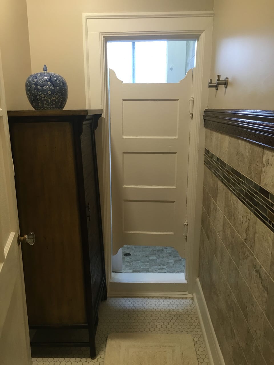 Private & gorgeous original shower room with custom tile work.