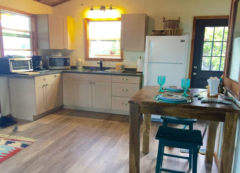 Awesome kitchenette! With every thing you need, counter height dining table