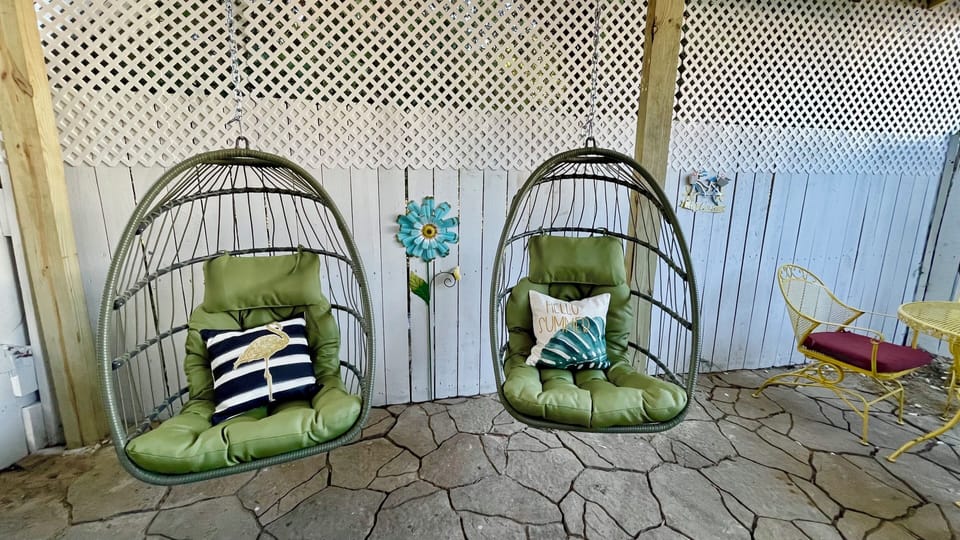 Egg chair swings in the private COVERED back patio