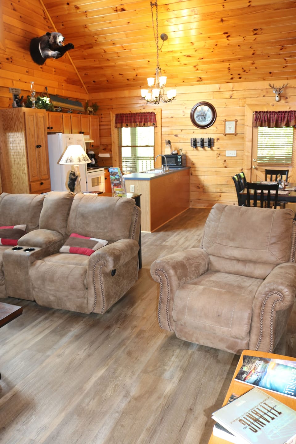 Living room with new hardwoods, recliner,  and reclining loveseat