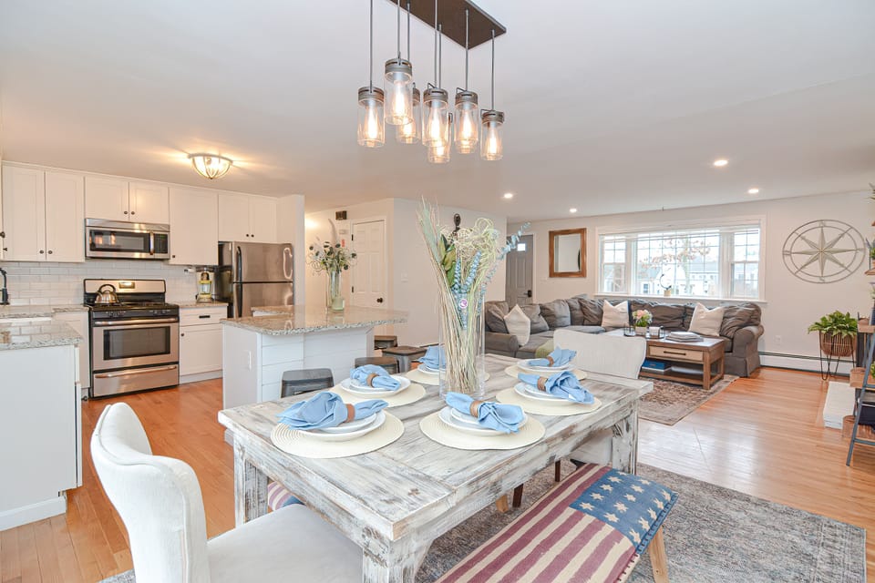 Gather & Dine — A farmhouse table with room for everyone, open to the living room.