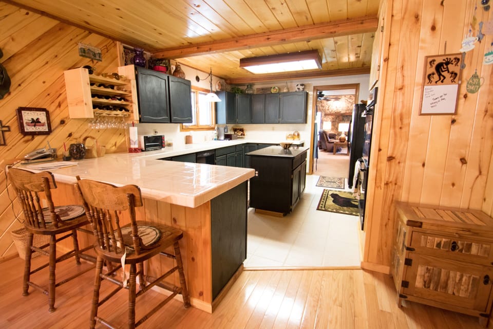 The spacious kitchen is well stocked with everything you might need.