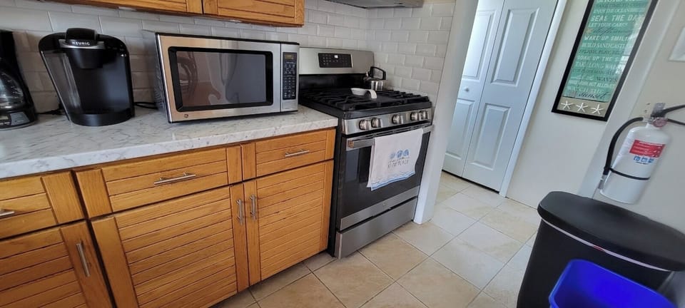 Kitchen with various appliances and including a Keurig, ice machine, etc.
