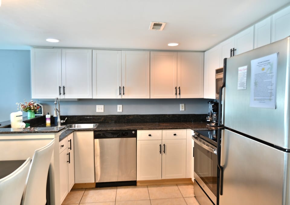 Modern kitchen with granite and stainless steel appliances