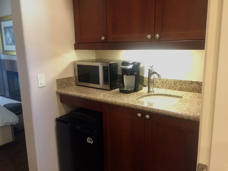 Mini Bar with Microwave, Under Counter Refrigerator, and Sink