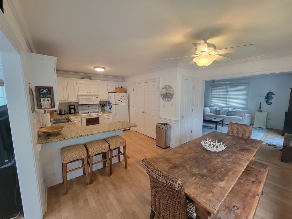 The kitchen connects the living and family rooms.  