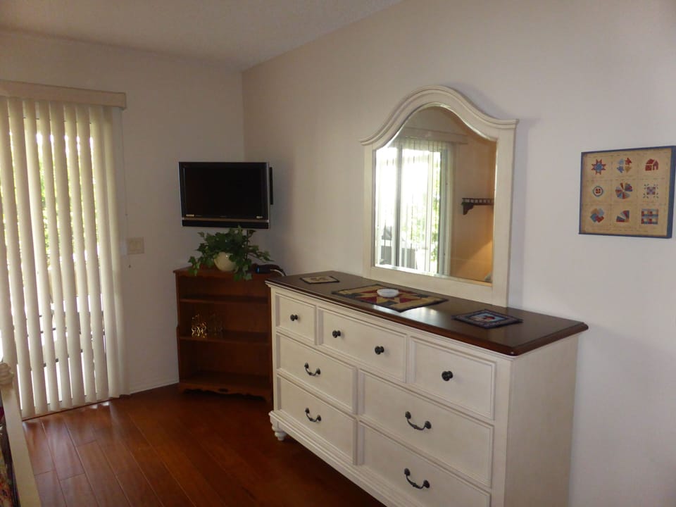 The master bedroom has Florida style furniture.