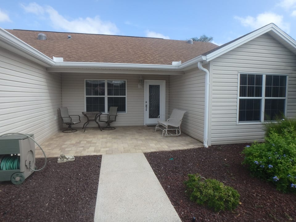 We extended the front porch this year - plenty of space to relax under cover.