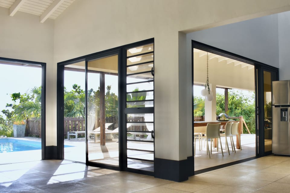 Inside, living room, kitchen and outside are open and connected.