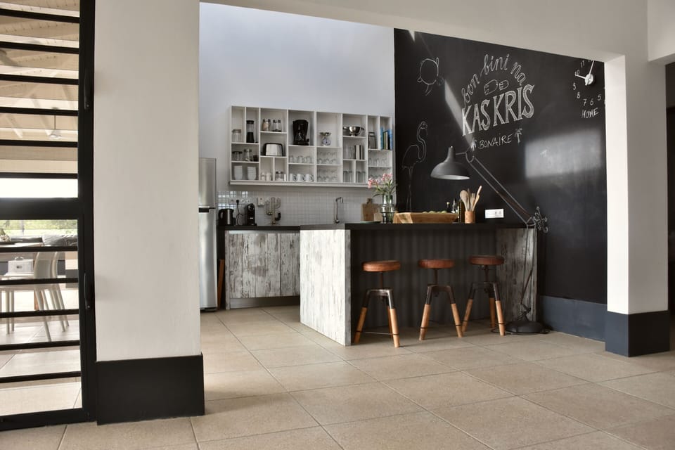The kitchen has an island and a bar.