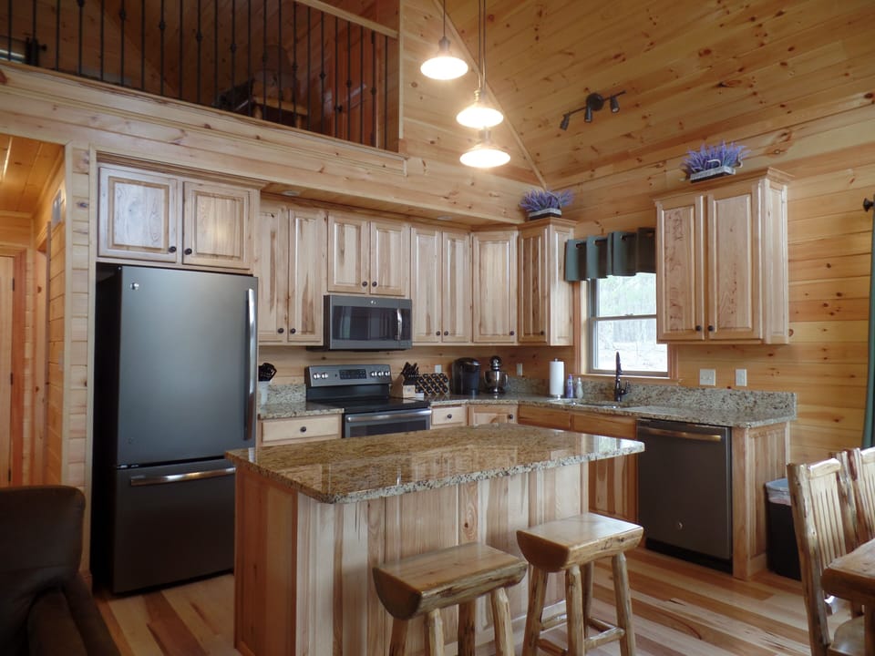 Kitchen view with a glimpse of the upstairs loft bedroom
