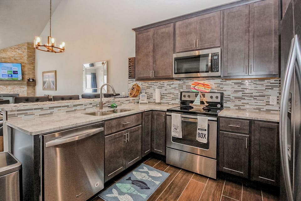 Fully updated, exotic white granite, crown molding, glass splash, stainless appl