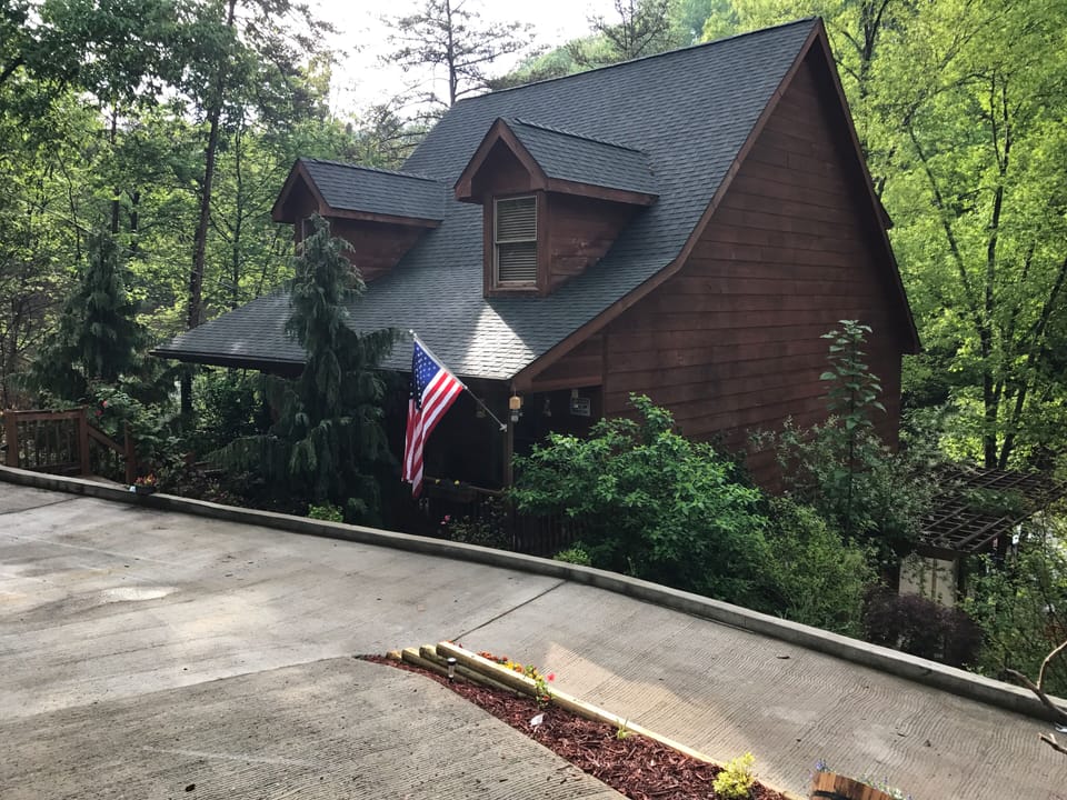 Lost Bear Cabin is a 3 story cedar wood frame vacation home   .