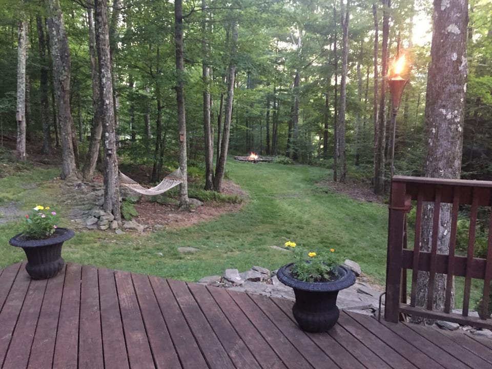 FRONT DECK LOOKING OUT TO FIRE PIT 
