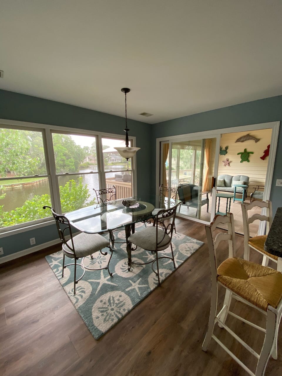 Kitchen table, 4 bar stools and water view.