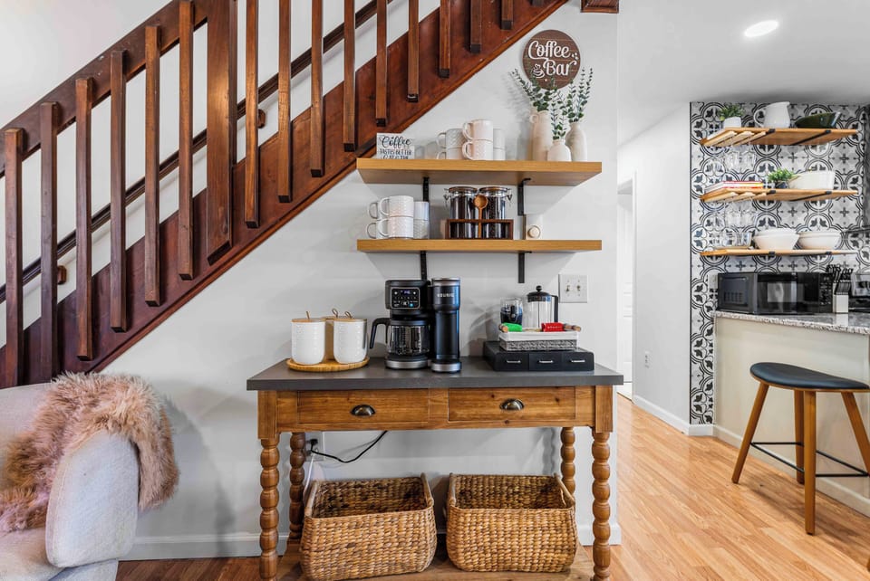 Coffee bar with fresh beans, French press, tea and hot chocolate.