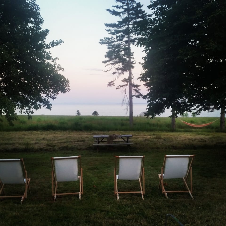 Sunset over the water from the chairs or hammock- you choose.