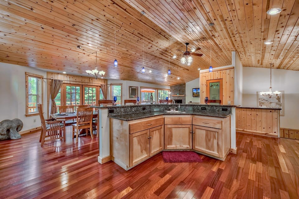 Open floor plan with adjoining kitchen, dining and living room.