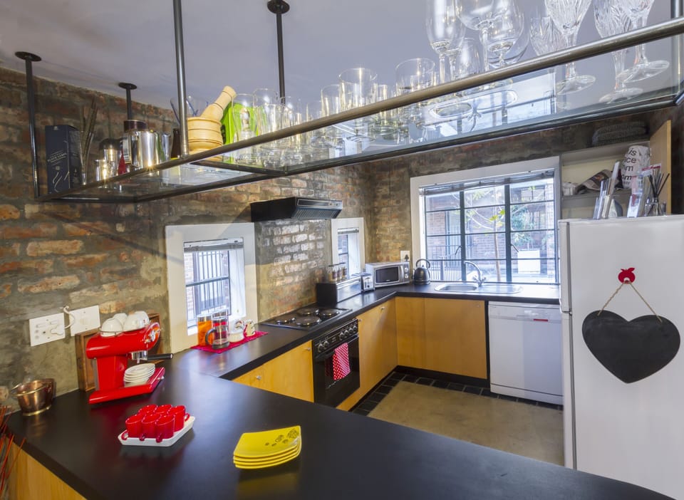 The kitchen is fully equipped with a washer/dryer, dishwasher, fridge freezer, 
