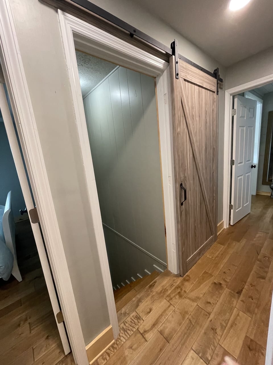 Barn door to stairs leading to lake level