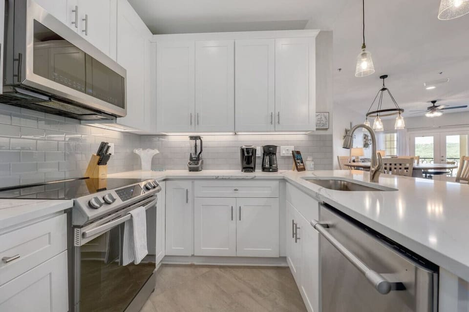 Cook with a view and plenty of space—bright chef-style kitchen with a large island at Lakeside Serenity in Lago Vista.