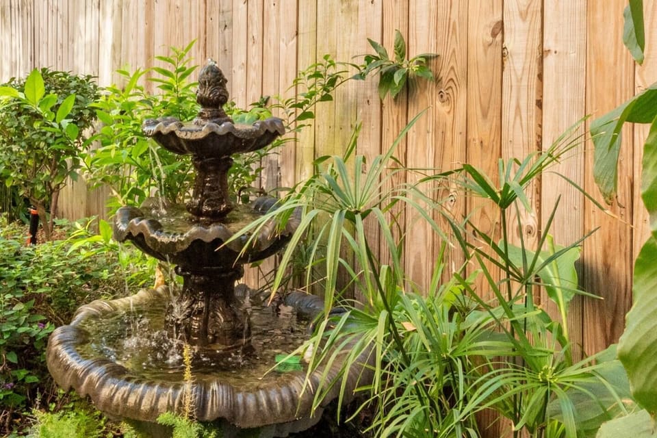 One of many spots in the courtyard, our quintessential New Orleans' fountain, embodies the city's timeless allure.