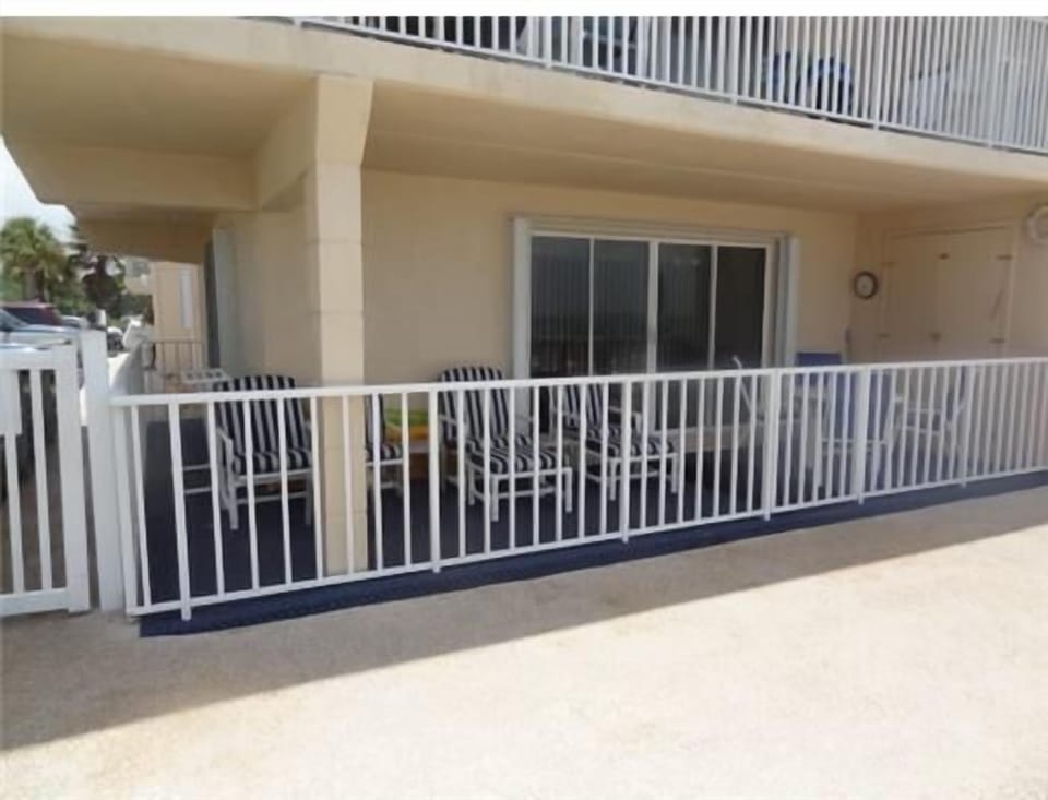 Over sized patio with table, 4 chairs and 4 lounge chairs