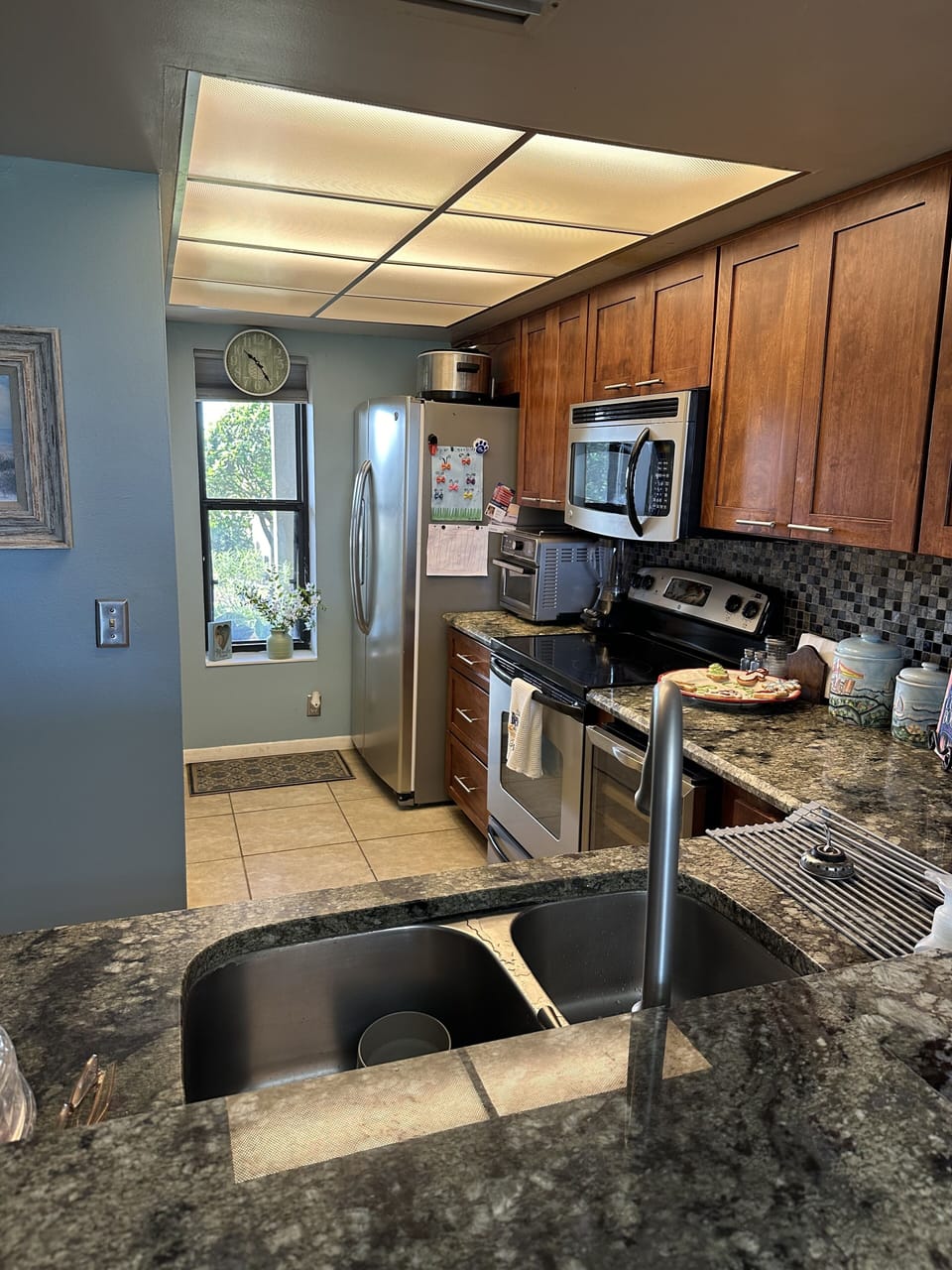 Kitchen includes a wide variety of cookware and glassware.  Keurig coffee maker 