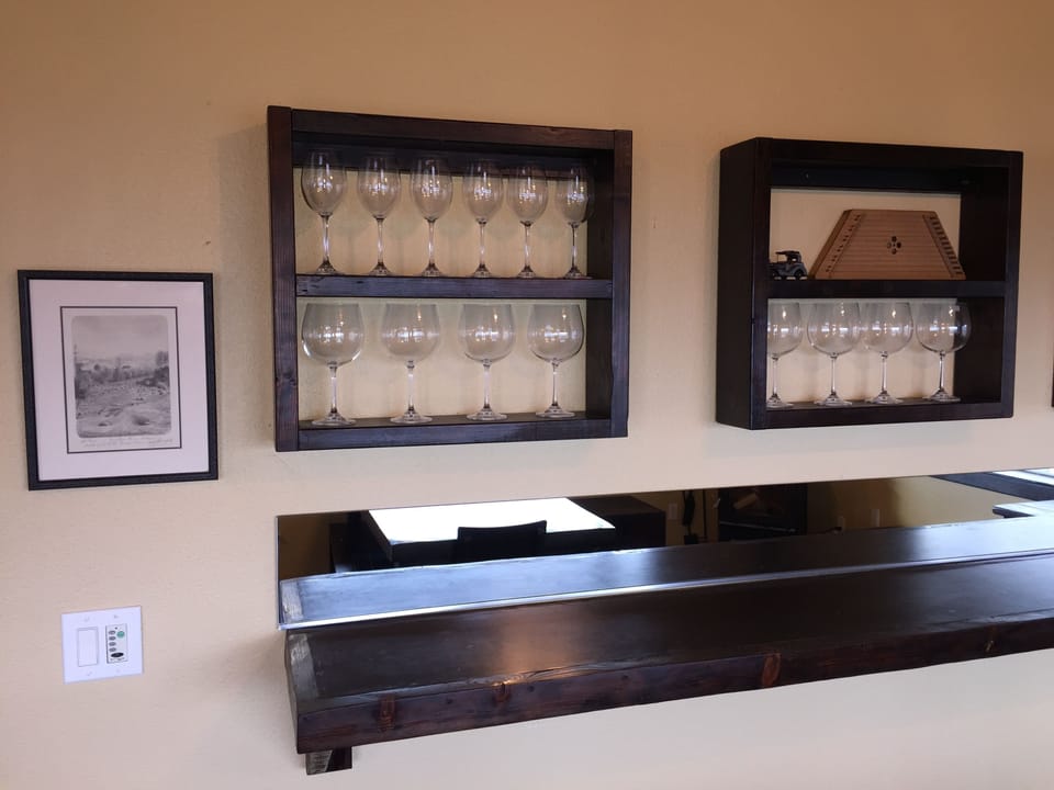 Two dozen wine glasses for red or white with additional 8 foot bar for appetizer