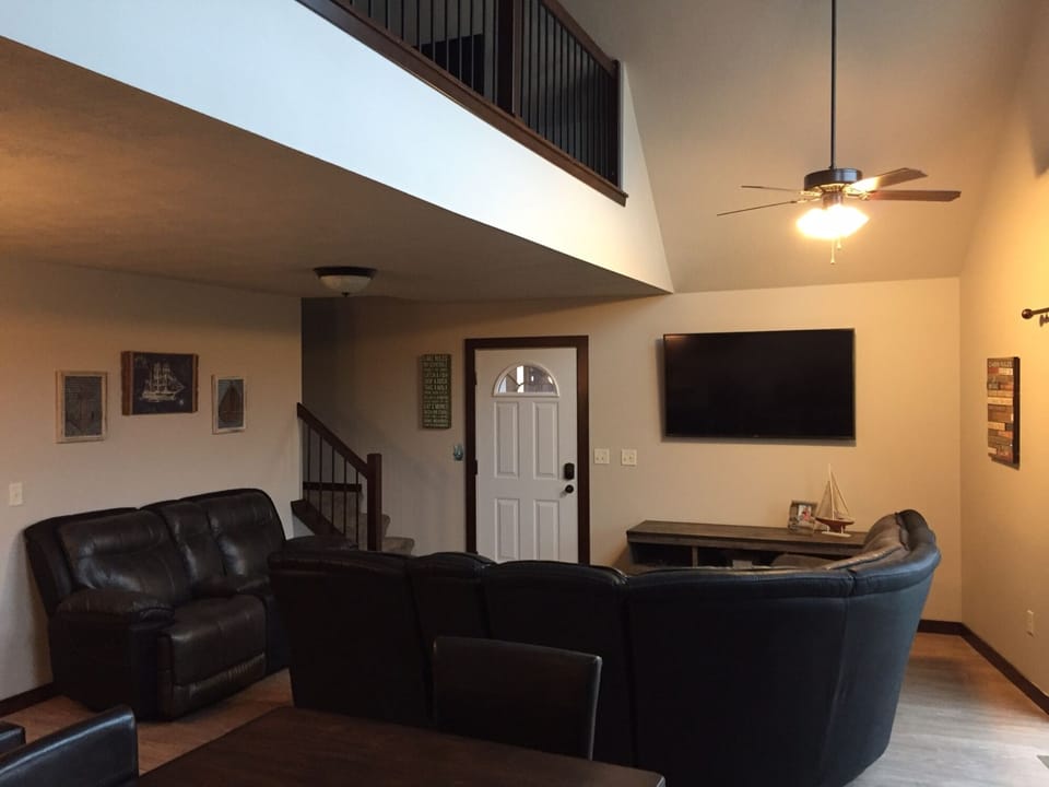 View of the living area and 60 inch 4K Flat Screen TV!  Direct TV and DVR!!