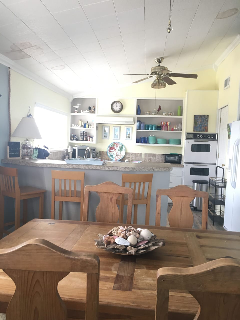 View into kitchen.  Electric stove, oven and dishwasher 