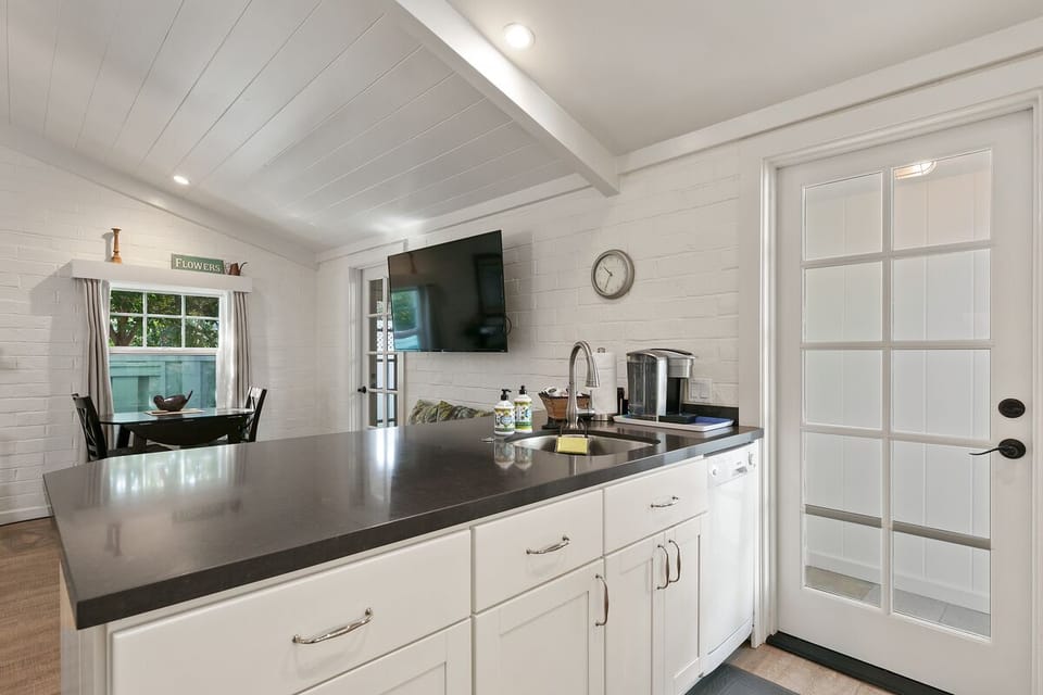 THE KITCHEN IS WELL STOCKED AND HAS A DISHWASHER
