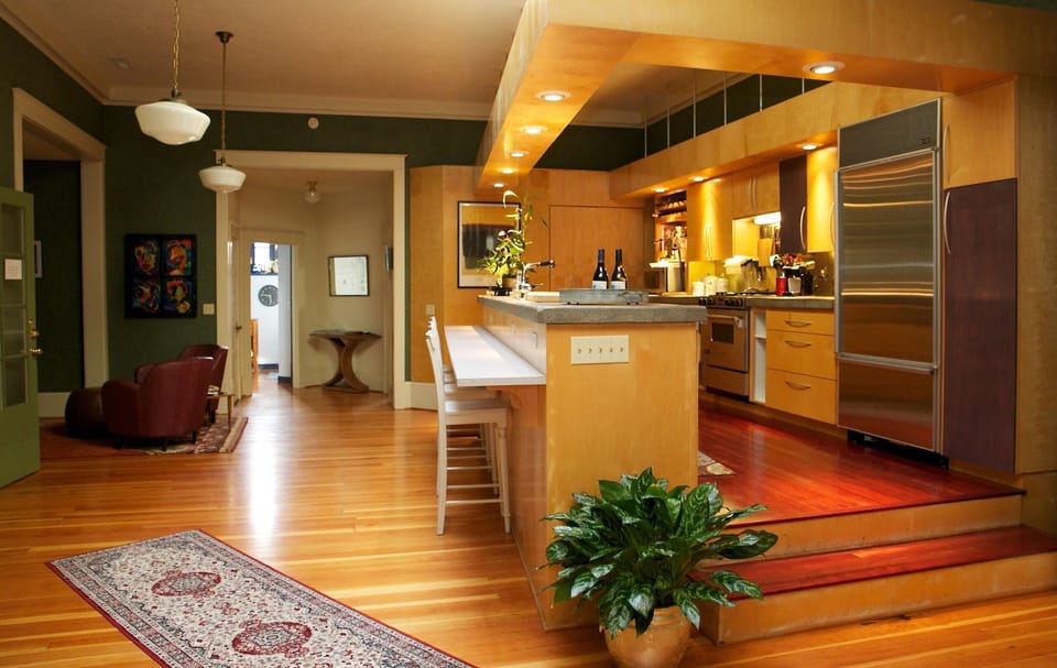 Fully stocked gourmet kitchen with bar.