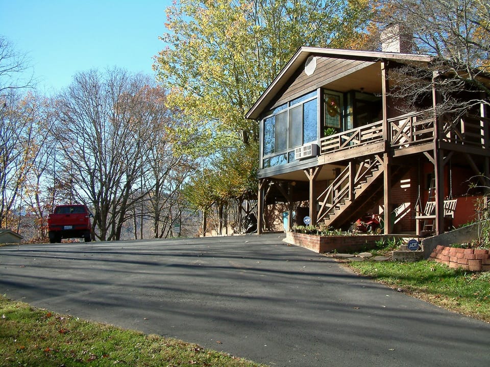 The house at the top of the driveway.  Your parking area is on the right.  