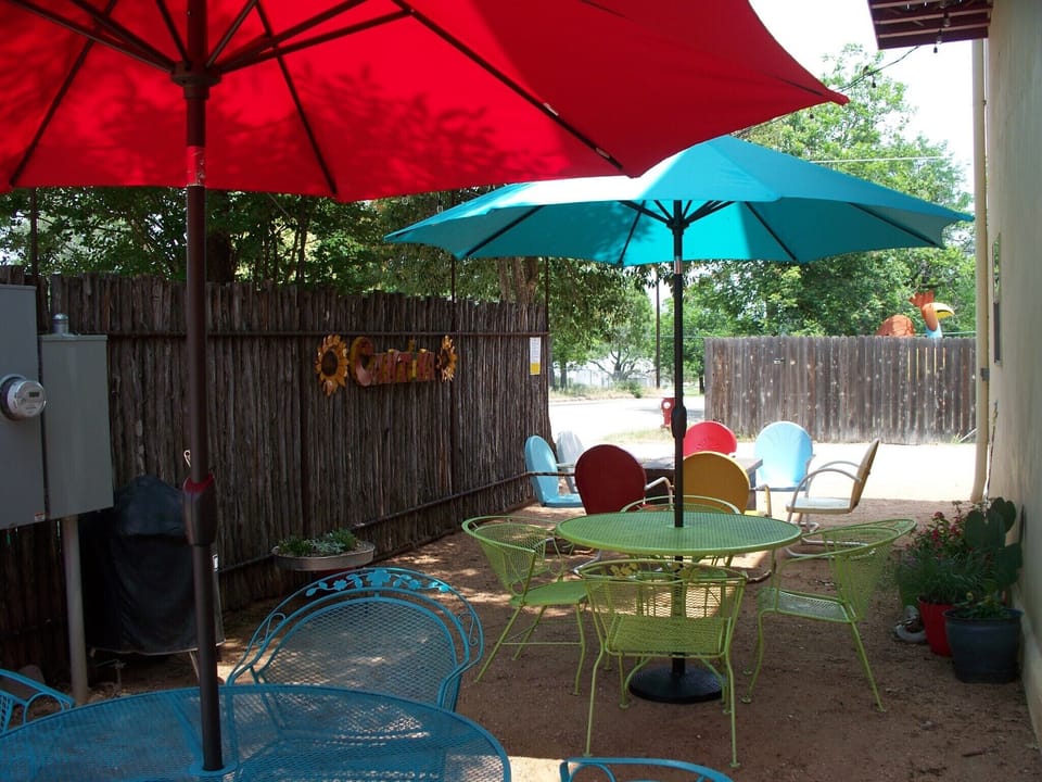 Enjoy evening wine under the party lights in the Cantina