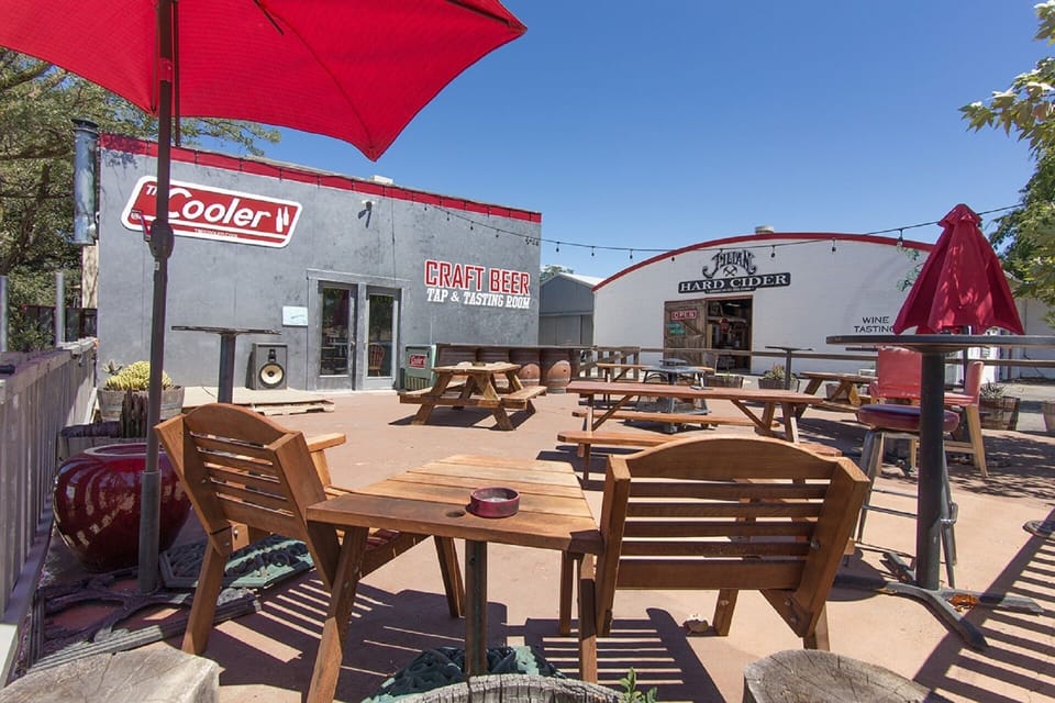 View of The Cooler Craft Beer patio and the main Julian Station building.