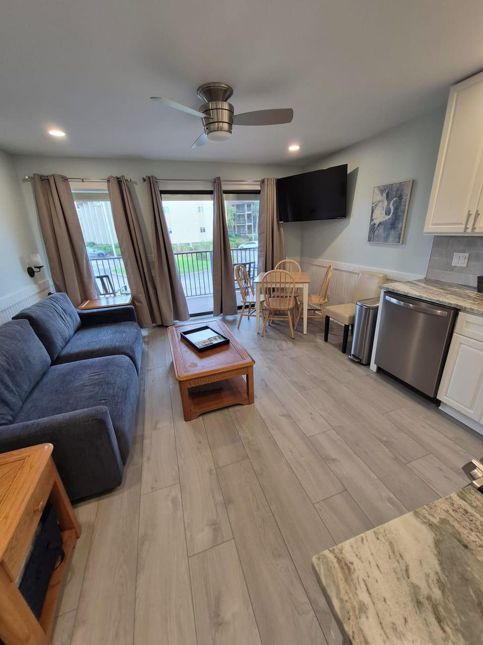 View of dining area, queen sleeper sofa, and kitchen