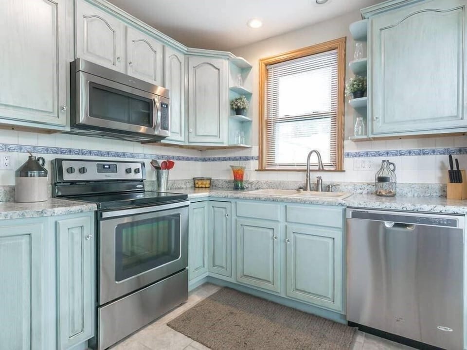 Kitchen with hand painted shabby chic cabinets