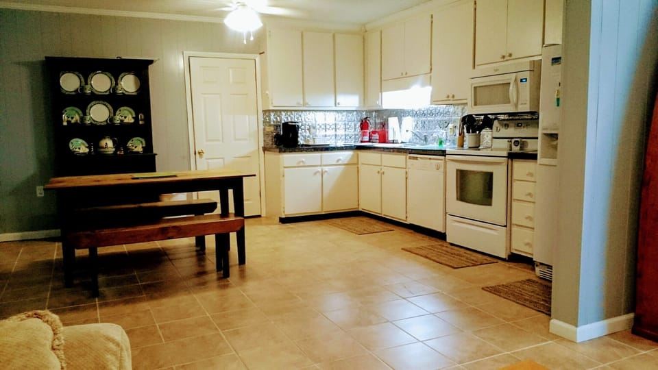 The kitchen is furnished with pots  and pans and all you need to fix a meal