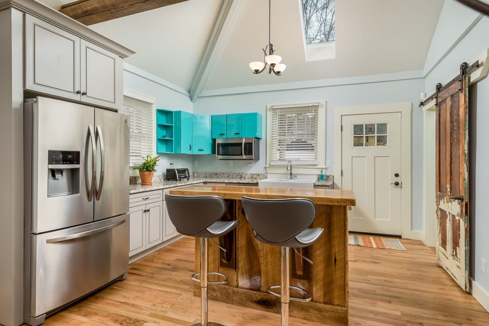 The Kitchen has Stainless Steel Appliances and is Stocked with Cooking Basics