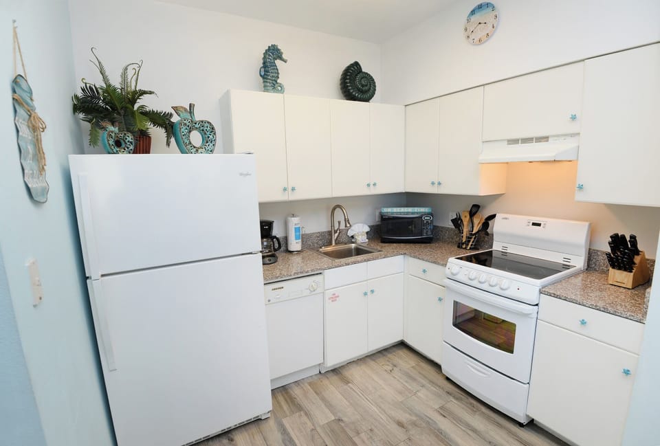 Full Kitchen with Refrigerator, coffee pot, dishwasher, microwave, stove,Standard coffee pot