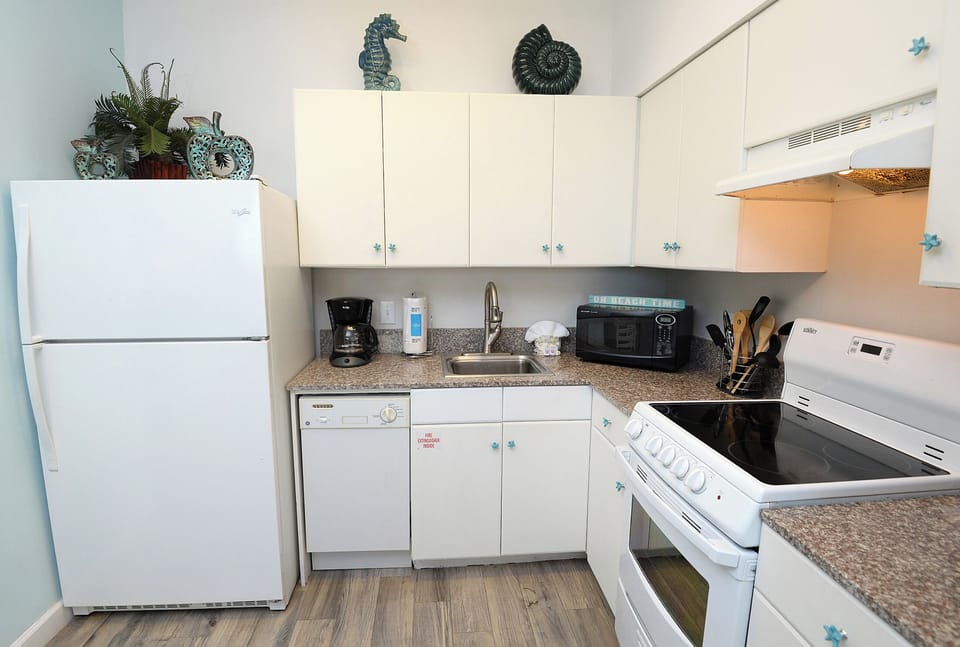 Full Kitchen with Refrigerator, coffee pot, dishwasher, microwave, stove,Standard coffee pot