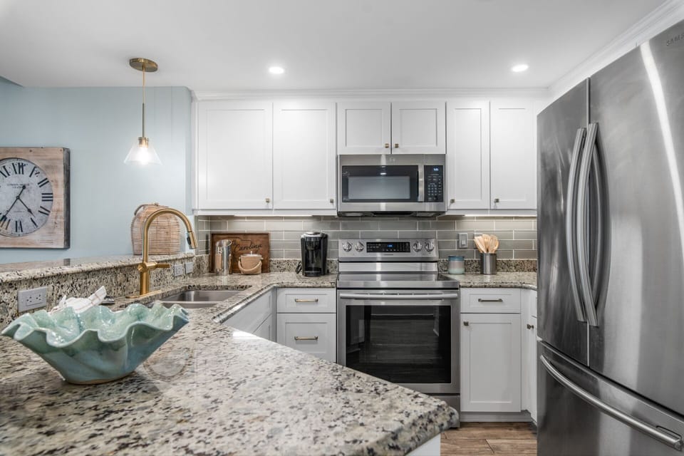 Updated kitchen with clean finishes and modern coastal feel
