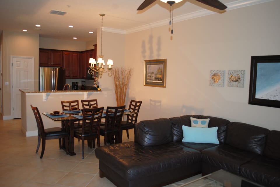 70" ceiling fan in living room keeps things cool. Decorator touches throughout.